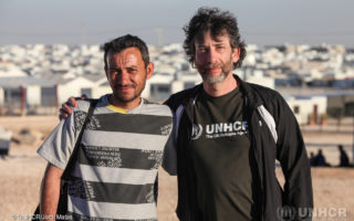 UNHCR High Profile Supporter, Neil Gaiman with Ayman, Syrian refugee volunteer nurse who provides medical assistance to the camp community.