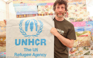 UNHCR High Profile Supporters Neil Gaiman and Georgina Chapman visit the distribution warehouse in the reception center for Syrian refugee families who have just hours before arrived in Jordan. Here refugees receive core relief items including UNHCR hygiene kits, cooking kits, blankets, sleeping mats, mattresses, tarpaulins, solar panel lamps, gas stoves, buckets and water containers.