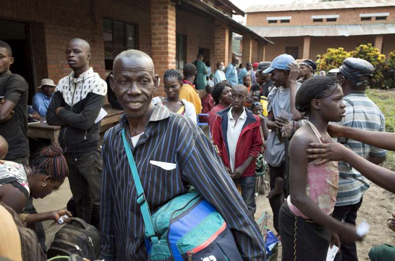 Antonio waits to have his documents checked by Angolan authorities before crossing the nearby border some 40 years after he fled from his country.