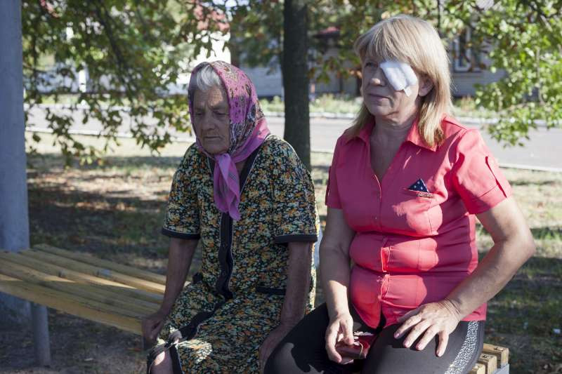 Liuba, 60, with her mother in the Kharkiv region. The two fled from their home town in eastern Ukraine with Liuba's husband. Liuba needed surgery for an eye injury.