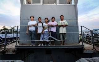 Bartolome and his family on the dredger that was their home for almost a month after Typhoon Haiyan smashed into Leyte Island in the central Philippines on November 8 last year. Bartolome and his family are rebuilding their lives: he and his wife have jobs and their children are back at school.