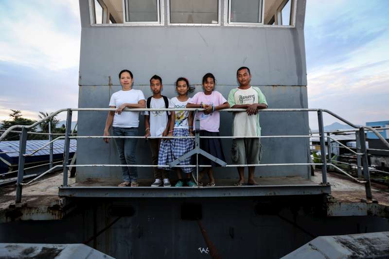 Bartolome and his family on the dredger that was their home for almost a month after Typhoon Haiyan smashed into Leyte Island in the central Philippines on November 8 last year. Bartolome and his family are rebuilding their lives: he and his wife have jobs and their children are back at school.