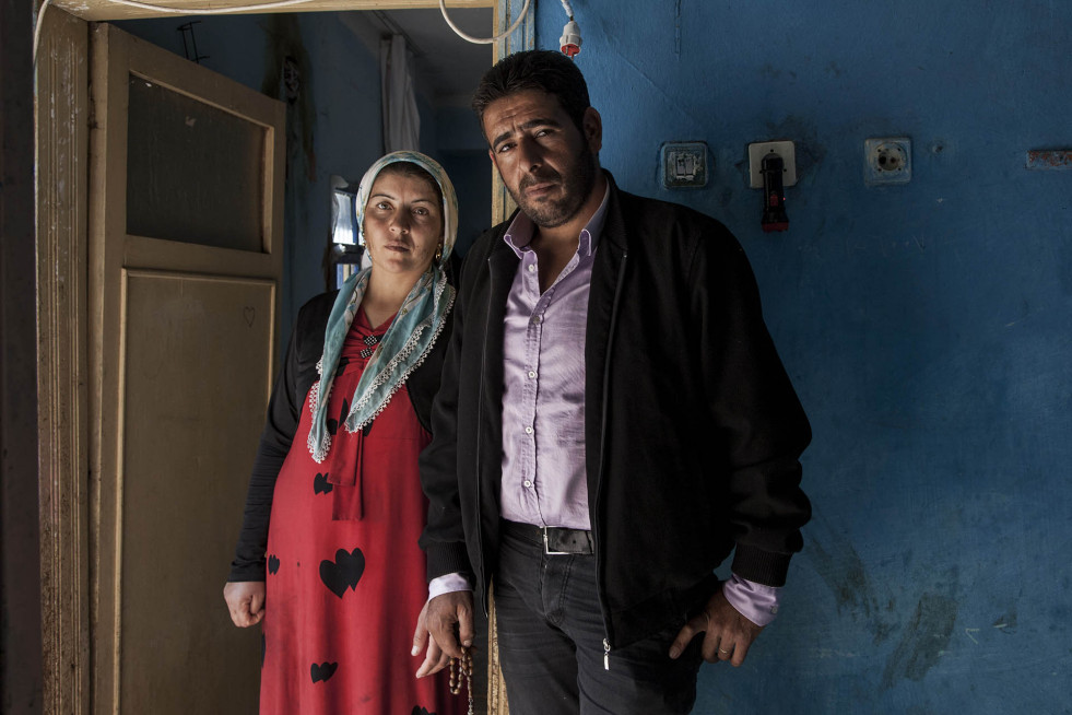 Ahmed, seen here with his wife, Fatma, left everything behind when they fled, including his beloved football uniform. 