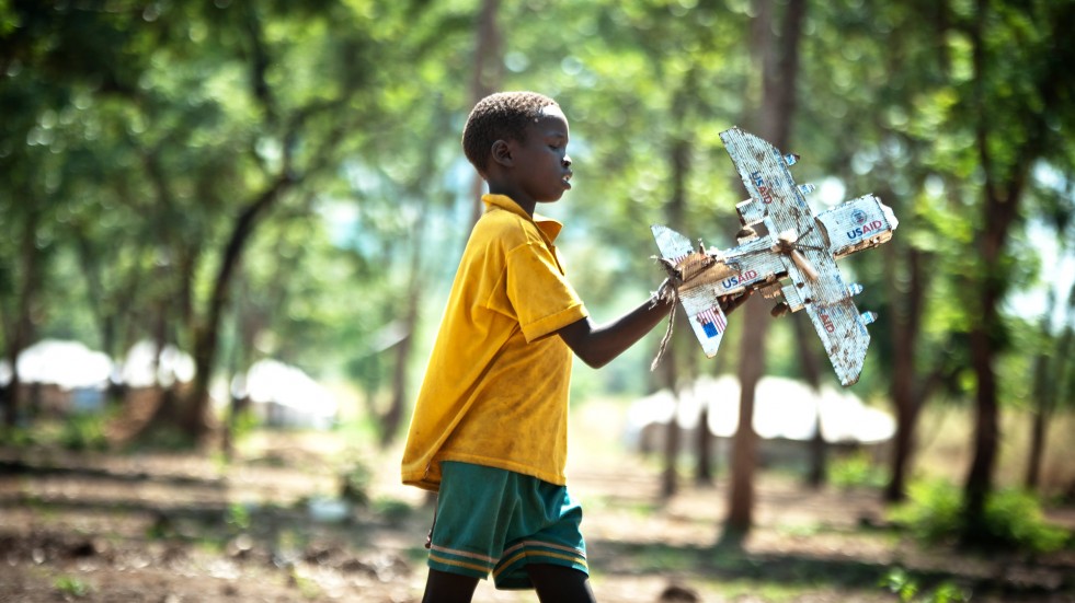 Gatdet, 11, made a toy plane from empty cans of cooking oil.