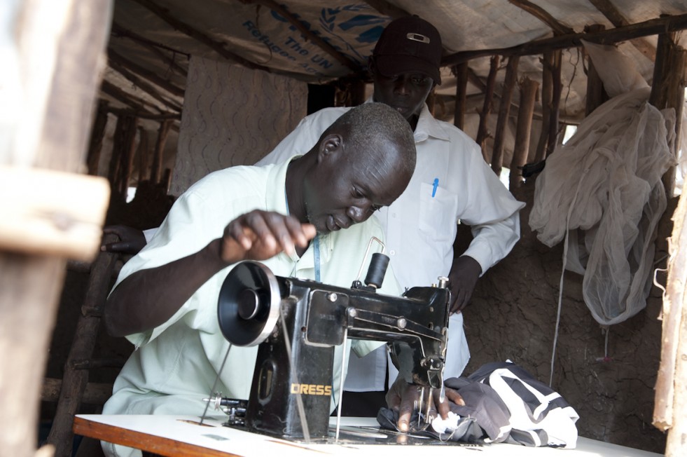 After fleeing his home in Malakal, South Sudan, Gatluak, a tailor, spent what little money he had left on a sewing machine—hoping to earn enough to return home one day. 