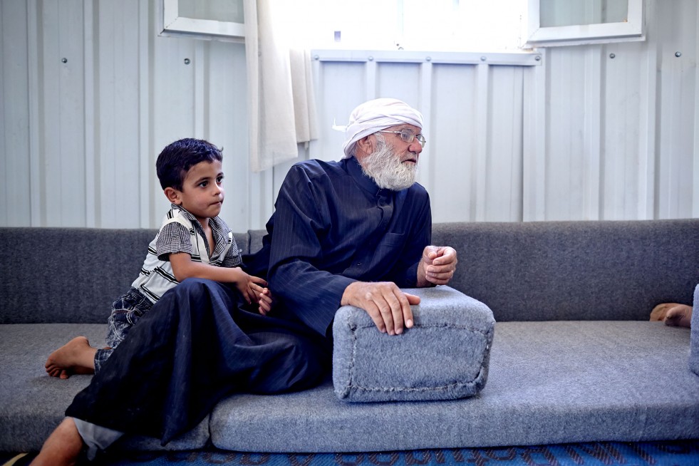 Since fleeing Syria, Kareem, 65, and grandson Hamza, 3, have been living at Azraq refugee camp in Jordan. “Having light helps our world at night take shape.”