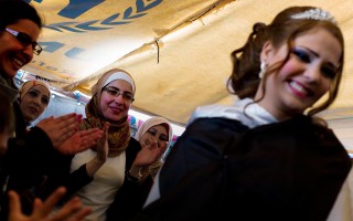 Friends of Mariam, a Syrian refugee, celebrate her marriage to Mohammed at Za'atari camp in Jordan.