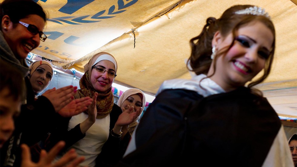 Friends of Mariam, a Syrian refugee, celebrate her marriage to Mohammed at Za'atari camp in Jordan.