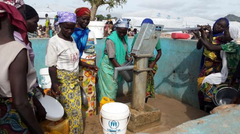 Refugees from Nigeria queue to get water at the Minawao camp in Cameroon. UNHCR has registered over 40,000 Nigerian refugees in Cameroon's Far North region to date, and 32,000 of them have moved to Minawao.