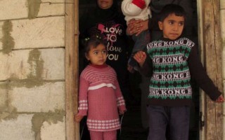 Members of a Syrian refugee family in their rented home in the southern Lebanese town of Abbasieh. More than 80 per cent of Syrian refugees in Lebanon rent their accommodation and pay on average US$200 a month.