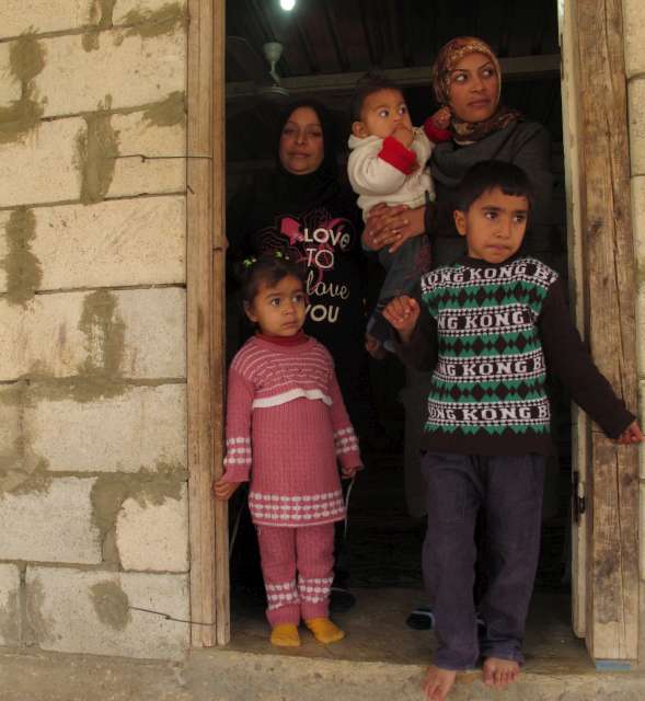 Members of a Syrian refugee family in their rented home in the southern Lebanese town of Abbasieh. More than 80 per cent of Syrian refugees in Lebanon rent their accommodation and pay on average US$200 a month.