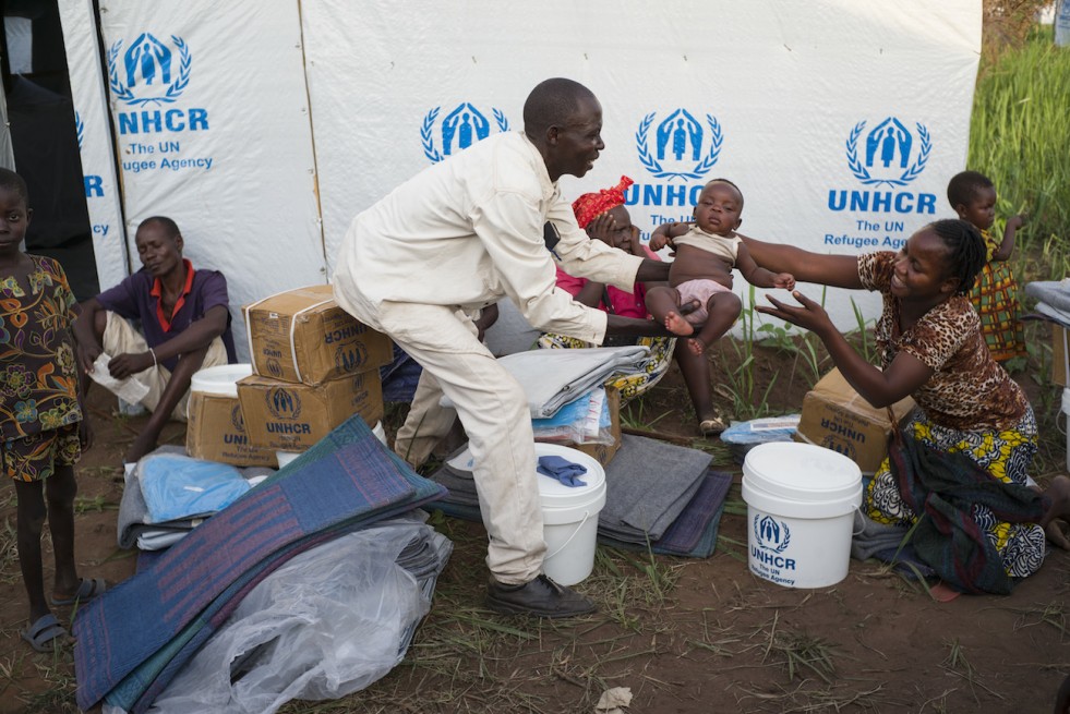 Jean, Edwige and their four surviving children wait their turn to register at Bili refugee camp, DRC, after fleeing violence in the Central African Republic..