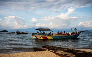 A boat carrying Burundian refugees approaches the Congolese village of Mboko on 12 May 2015.