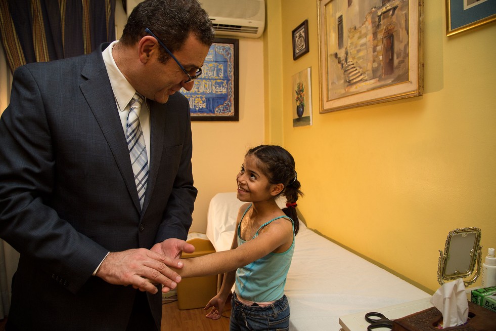 Dr. Amr Mabrouk, a plastic surgeon at Ain Shams University in Cairo, meets with young Judy. 