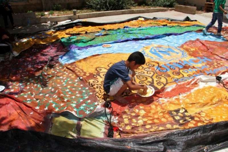 The artwork on this tent was inspired by the Austrian symbolist painter Gustav Klimt and the Syrian poet Nizar Qabbani. It was painted in the courtyard of a refugee centre in northern Jordan.