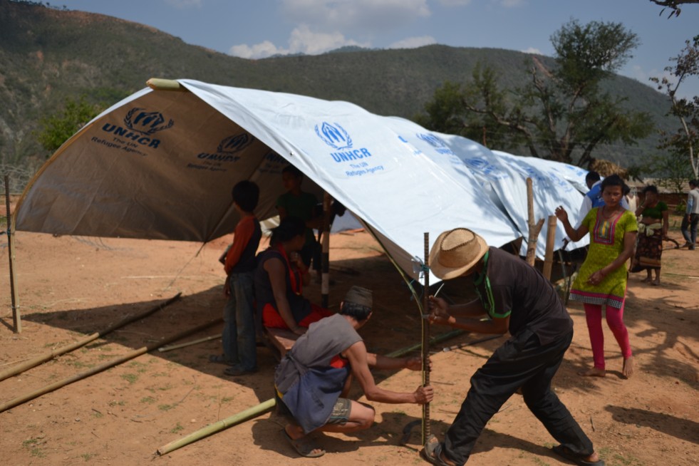 Tarpaulins are used to provide temporary shelter for families.