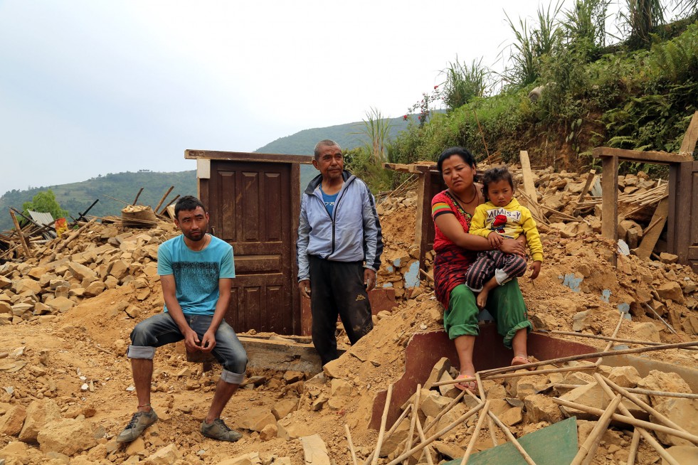 Raj Kumar Tamang (left) was working in Bahrain when the earthquake hit. He flew home to help his family – including his father, sister and nephew – pick up the pieces. 