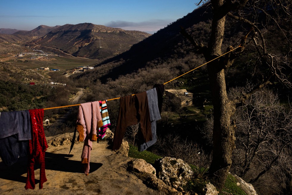 Clothes belonging to internally displaced people hang to dry above Lalish Temple in Shekhan, a district in Iraq’s Kurdish region. The village is hosting about 120 families displaced by fighting. 