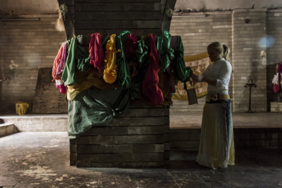 A Yazidi woman, recently released from captivity, prays in the holy Lalish Temple outside of Dohuk, in the Kurdistan Region of Iraq. 