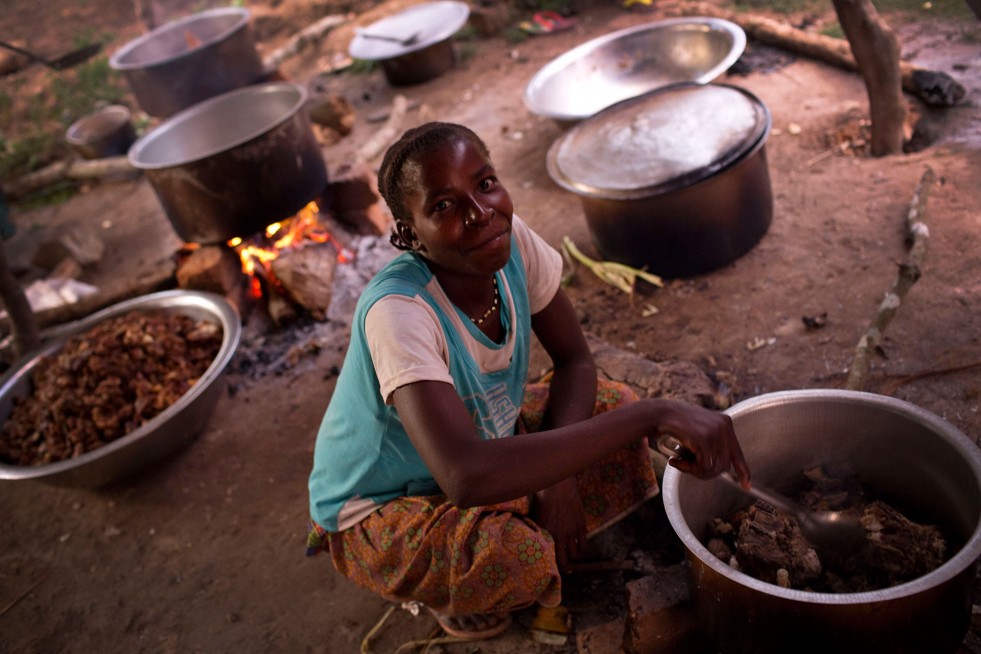 Marie cooks an evening meal at Sister Angélique's home in Dungu, in eastern Democratic Republic of the Congo. 