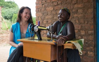 UNHCR High Profile Supporter Kristin Davis spends time with Fiona Taba (18) a South Sudanese refugee who's become a tailor and a fashion designer. Fiona also cultivates a plot of land that was donated by the Ugandan Governmnet at the Rhino Base camps settlement.