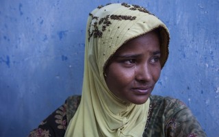 A Rohingya refugee cries as she is waiting to be transported to a temporary shelter on May 20 in East Aceh, Aceh province, Indonesia.