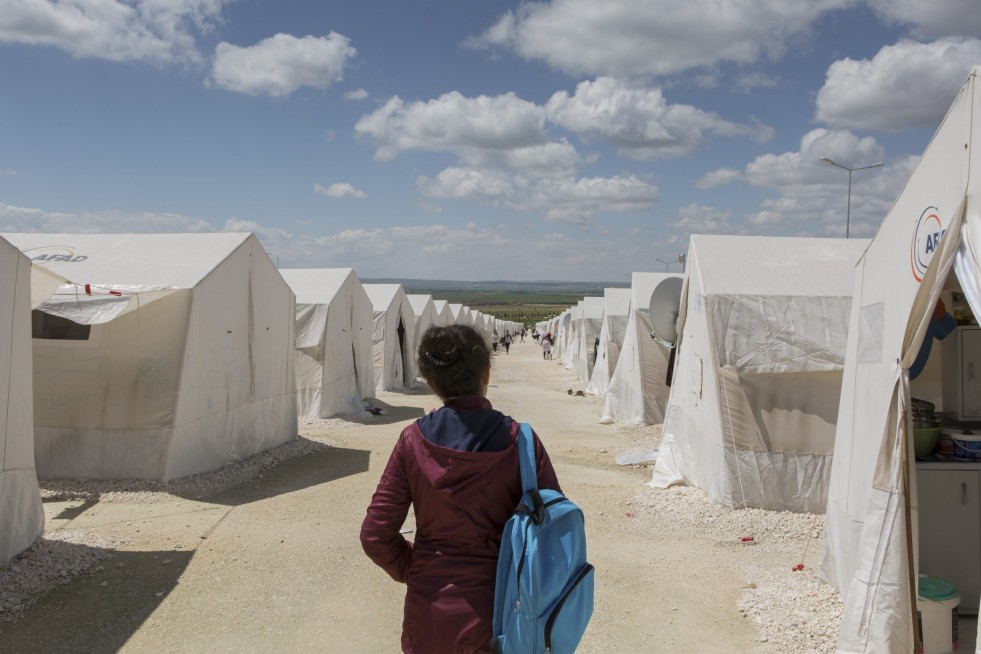  Ivra walks back to her families tent after school in Suruç camp. 