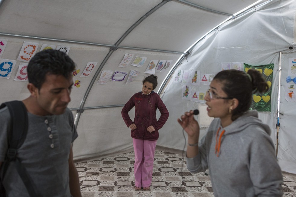 At Suruç camp in Turkey, Ivra rehearses for a play with friends and a drama teacher from Kobane, Syria.