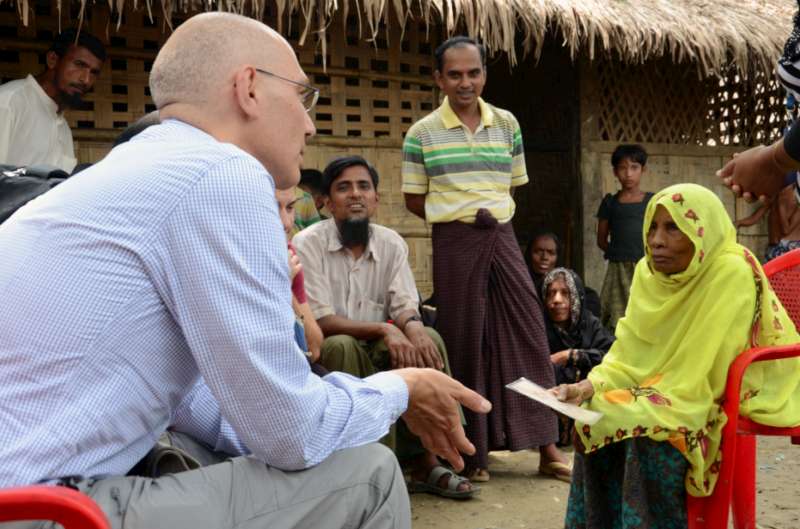 Assistant High Commissioner for Protection Volker Türk speaks with an elderly woman in a Rohingya village near Maungdaw, northern Rakhine State, Myanmar, on 12 July 2015.