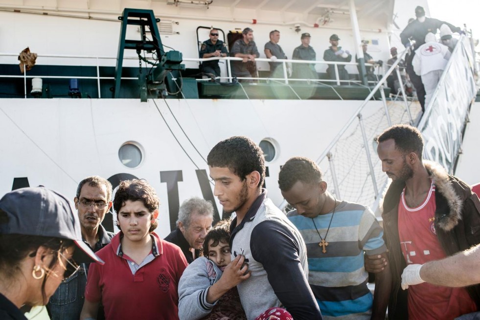 Abdo, 17, carried his little sister Diana, 10, off a naval rescue ship at the Sicilian port of Augusta.