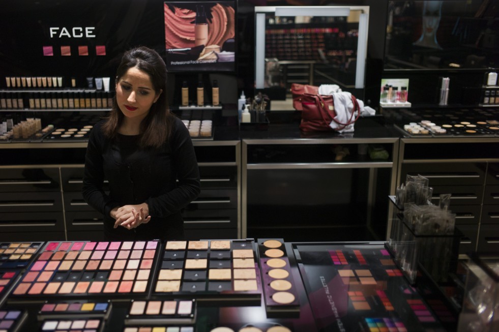 Simav, 22, had been studying law in Qamishli when violence in Syria forced her family to flee to Iraq. Now she works at a makeup counter in an Erbil shopping mall.