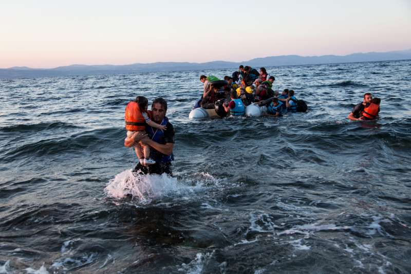 A group of Syrian refugees arrive on the island of Lesbos after traveling in an inflatable raft from Turkey, near Skala Sykaminias, Greece.