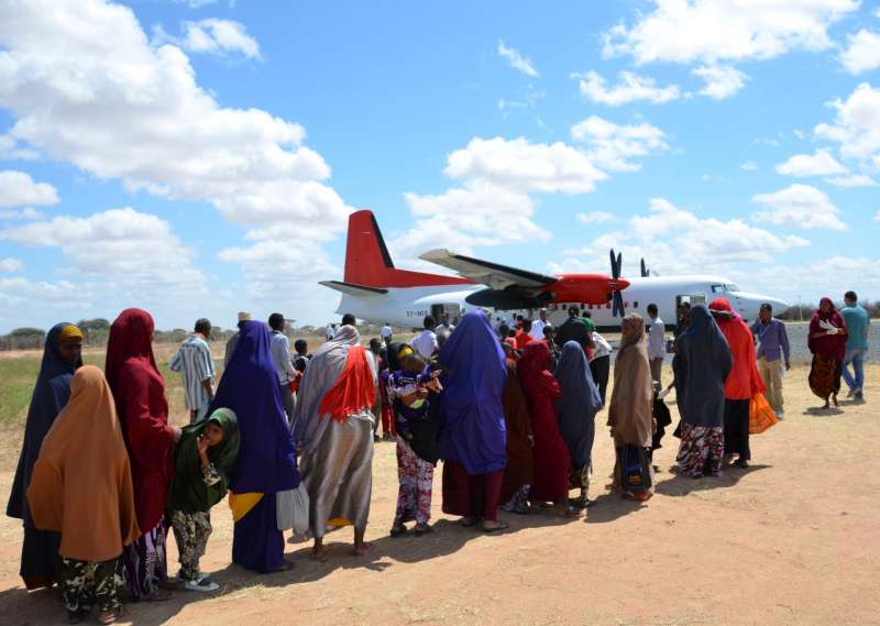Somali refugees board a plane to return to Mogadishu from Dadaab camp in Kenya.