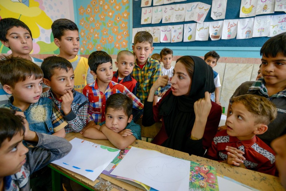 As a volunteer teacher, Sonita, 25, discusses Afghan culture with students at a summer school in Varamin, a city south-east of Tehran.