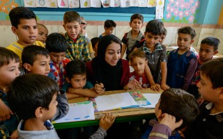 Sonita teaches young Afghan refugees at a summer school in Iran.