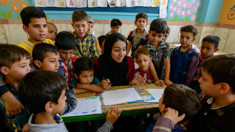 Sonita teaches young Afghan refugees at a summer school in Iran.