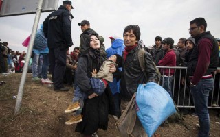 Family heading to a police van in no man's land between two Croatian and Serbian border near Tovarnik (Croatia).