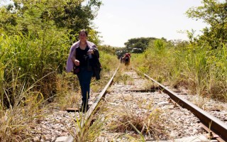 A woman from El Salvador walks along train tracks in Chiapas, Mexico, October 2015.