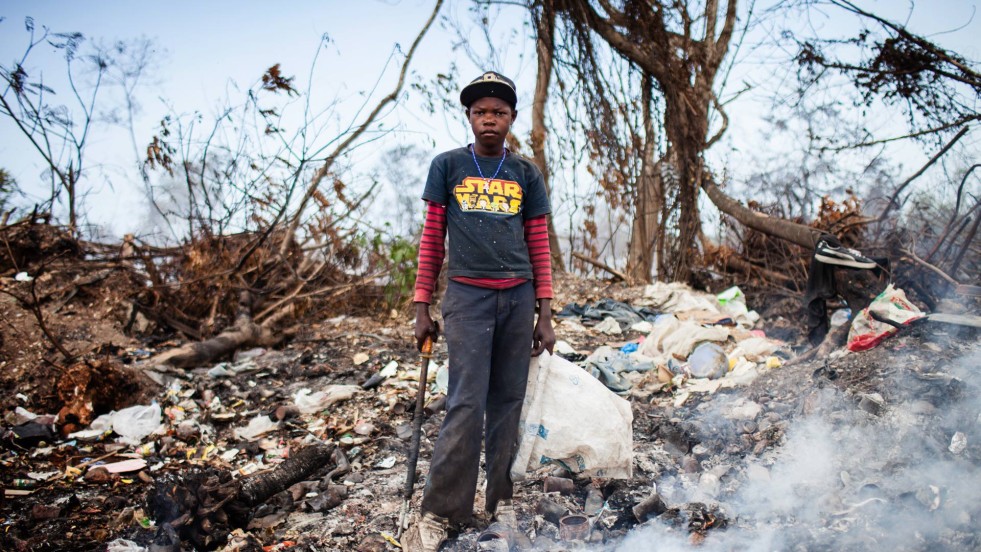 Joe spends his summer searching for metal scraps to earn money.