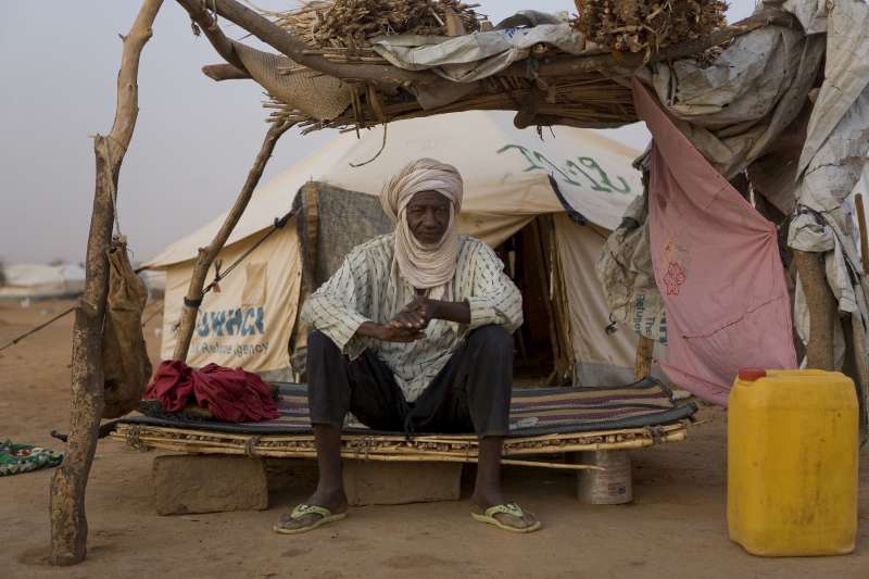 Malian refugee Alassane Maïga sits on a makeshift bed at Abala refugee camp in Niger.