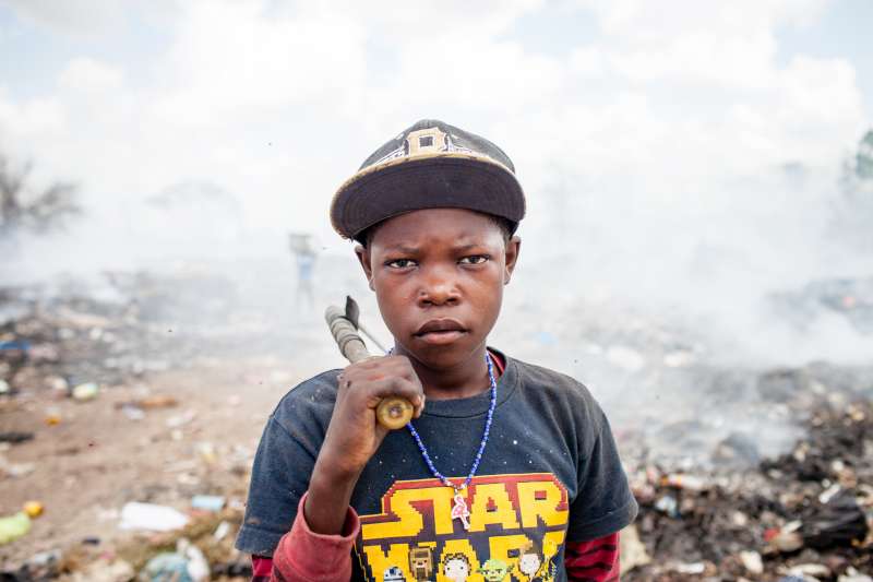 Joe Hullman, 13, works at San Pedro de Macoris municipal dump during his summer vacations looking for metal scraps in San Pedro de Macoris, in Dominican Republic.