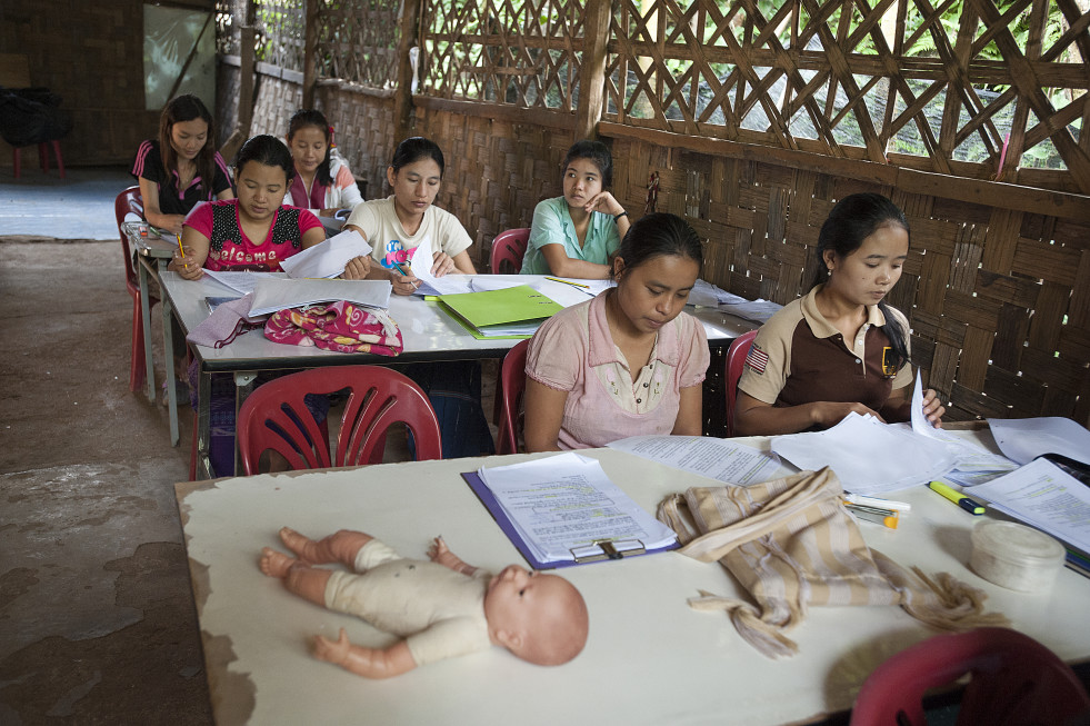 IRC work in the Ban Mai Nai Soi camp in Northern Thailand training assistant midwives. Dr Ma Myo Aye is the medical trainer pictured here teaching the six week course in Reproductive and Child Health.