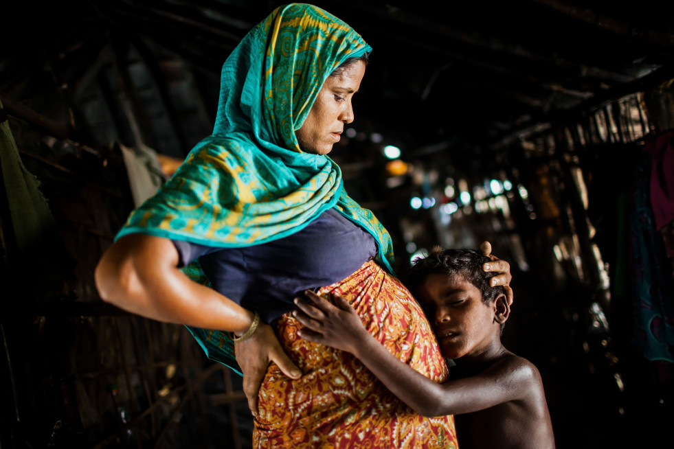 Nur Nahar, 30, with her middle son. She is the wife of Rahamat Ullah, 35. They came to Bangladesh together about fifteen years ago from Maungdaw, Sittwe, Myanmar to escape the violence and torture of the Myanmar Security forces. 