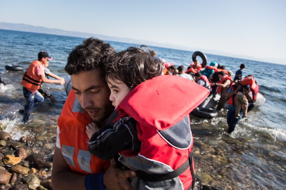 A group of Syrian refugees arrive on the island of Lesbos after traveling in an inflatable raft from Turkey, near Molyvos, Greece.