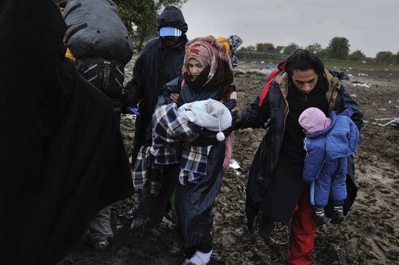 Syrian refugee Mohamed, his wife Fatima and their two babies wait in Serbia to cross into Croatia.