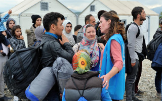 Alexandra Krause, Senior Emergency Coordinator, at work in Former Yugoslav Republic of Macedonia. Talking with Afgan refugees waiting to enter Vinojug Reception Center near the border with Greece.