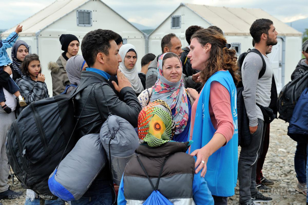 Alexandra Krause, Senior Emergency Coordinator, at work in Former Yugoslav Republic of Macedonia. Talking with Afgan refugees waiting to enter Vinojug Reception Center near the border with Greece.