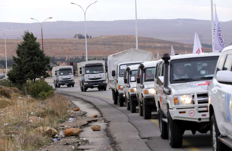 An aid convoy carrying food, medicine and blankets leaves the Syrian capital Damascus headed to the besieged town of Madaya on January 11, 2016