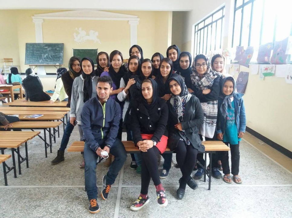 Omid Ahmadi and the class of Afghan girls and women whom he taught English in a refugee camp in Greece earlier this year. © Omid Ahmadi