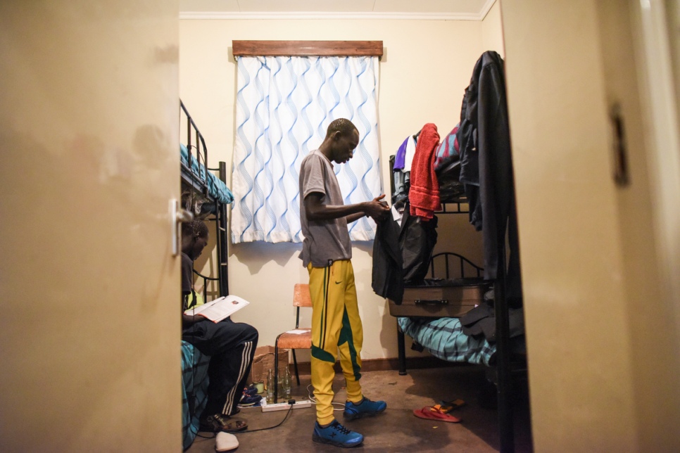 James packs his belongings before departure for Rio, where he will compete in the 800 metres. © UNHCR/Benjamin Loyseau